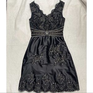 Short black dress with beading design